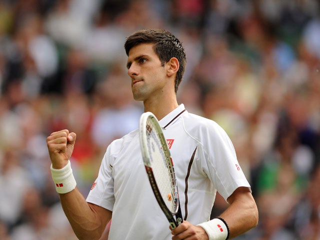 Serbia's Novak Djokovic celebrates a point against France's Jeremy Chardy during day six of the Wimbledon Championships on June 29, 2013