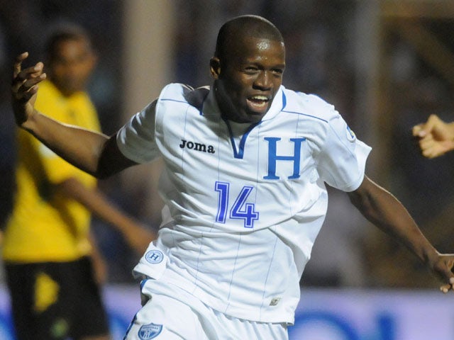 Honduras' Oscar Garcia celebrates after scoring against Jamaica during a 2014 World Cup qualifying soccer match on June 11, 2013