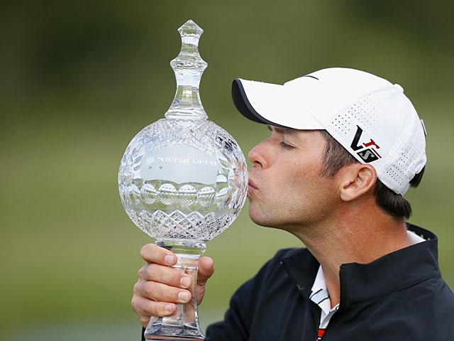 Paul Casey kisses the trophy as he celebrates winning the Irish Open on June 30, 2013