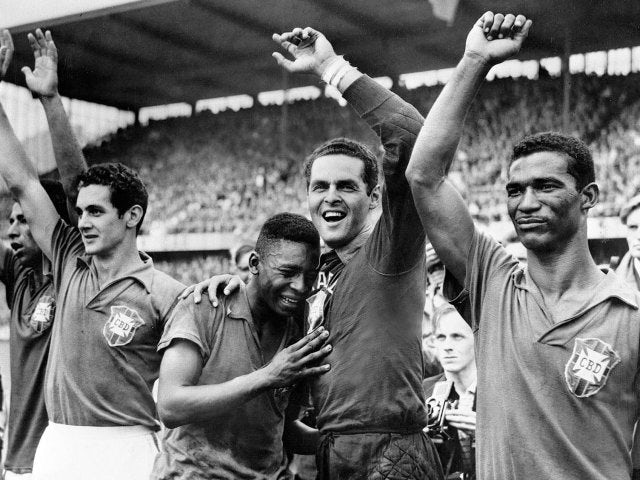 An emotional Pele celebrates winning the 1958 World Cup with his teammates.
