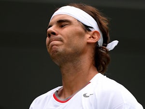 Rafa Nadal looks disappointed during his game with Steve Darcis on June 24, 2013