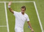 Richard Gasquet of France gestures to the public after defeating Marcel Granollers of Spain in their Men's first round singles match on June 25, 2013