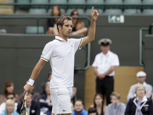 Richard Gasquet of France contests a point as he plays Go Soeda of Japan in their Men's second round singles match on June 27, 2013