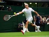 Roger Federer plays a shot against Victor Hanescu during the first round of Wimbledon on June 24, 2013