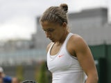 Sara Errani walks to her seat during her first round loss to Monica Puig on June 24, 2013
