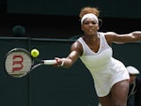 Serena Williams of the United States plays a return to Mandy Minella of Luxembourg during their Women's first round singles match on June 25, 2013