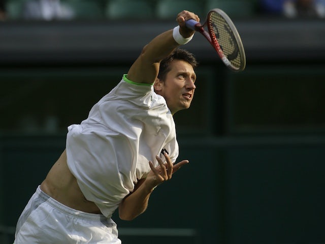 Sergiy Stakhovsky in action against Roger Federer on June 26, 2013