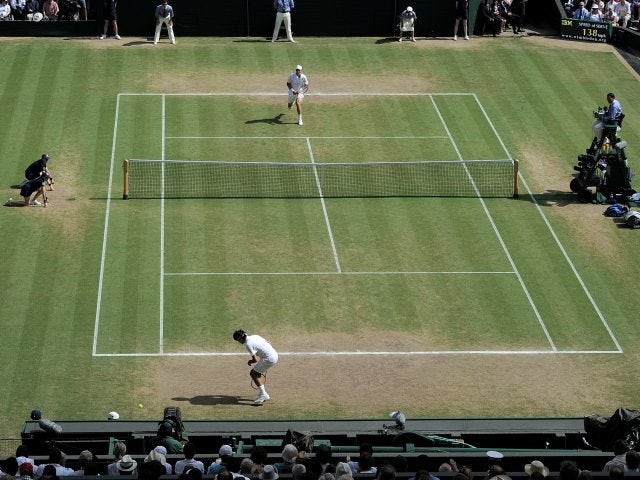 Tomas Berdych plays a winner against Roger Federer at Wimbledon.