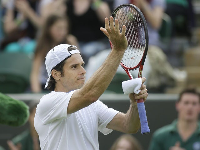 Tommy Haas of Germany waves to the crowd after defeating Dmitry Tursunov of Russia in a Men's first round singles match on June 25, 2013