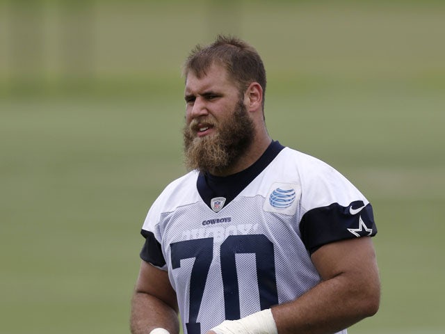 Dallas Cowboys first-round draft pick Travis Frederick walks off the field at the NFL football team's training facility on May 28, 2013