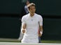 Andy Murray reacts after beating Mikhail Youzhny during their Wimbledon match on July 1, 2013