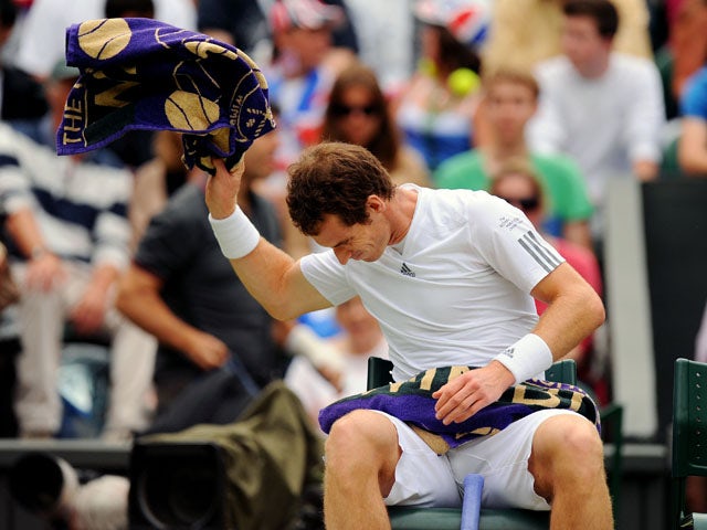Great Britain's Andy Murray throws his towel down in his match against Spain's Fernando Verdasco during day nine of the Wimbledon Championships on July 3, 2013