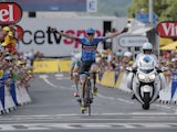 Daniel Martin of Ireland crosses the finish line ahead of Jakob Fuglsang of Denmark to win the ninth stage of the Tour de France on July 7, 2013