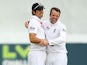 England's Alastair Cook and Graeme Swann celebrate a wicket during day four of the International Tour match against Essex on July 3, 2013