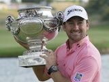 Graeme McDowell of Northern Ireland holds the trophy during the winning ceremony of the French Open Golf tournament on July 7, 2013