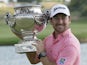 Graeme McDowell of Northern Ireland holds the trophy during the winning ceremony of the French Open Golf tournament on July 7, 2013