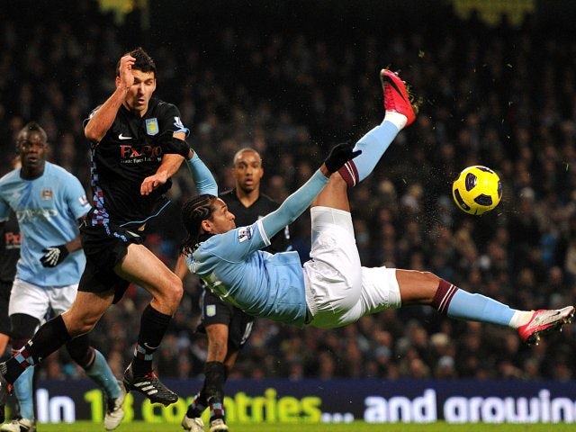 Jo attempts an overhead kick while playing for Manchester City.