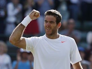 Juan Martin Del Potro punches the air moments after defeating Andreas Seppi during their Wimbledon match on July 1, 2013