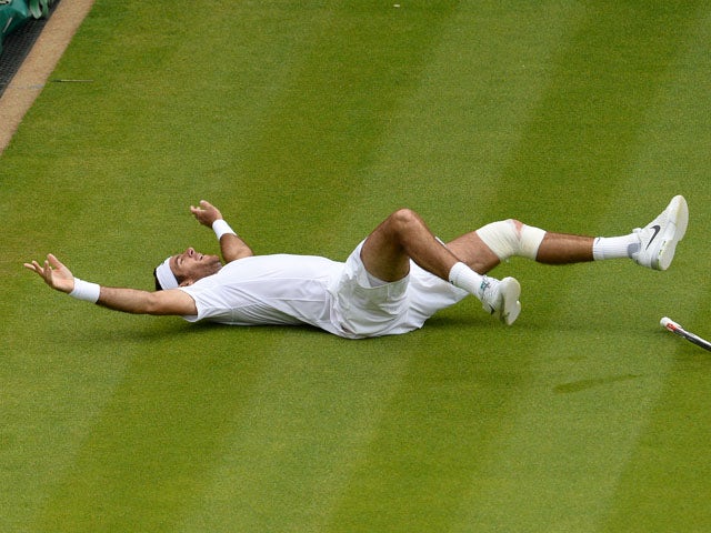 Argentina's Juan Martin Del Potro celebrates defeating Spain's David Ferrer on day 9 of the Wimbledon Tennis Championships on July 3, 2013