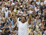 Juan Martin Del Potro of Argentina reacts after defeating David Ferrer of Spain in their Men's singles quarterfinal match on July 3, 2013