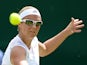 Belgium's Kirsten Flipkens in action against Italy's Flavia Pennetta during day seven of the Wimbledon Championships on July 1, 2013