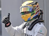 Lewis Hamilton celebrates gaining pole position at the German GP on July 6, 2013