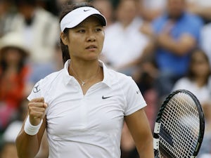 Li Na of China reacts after winning a point against Roberta Vinci of Italy during a Women's singles match at the All England Lawn Tennis Championships on July 1, 2013