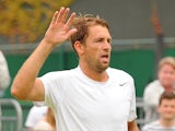 Poland's Lukasz Kubot celebrates defeating France's Adrian Mannarino after winning their match during day seven of the Wimbledon Tennis Championships on July 1, 2013