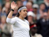 Marion Bartoli waves to the crowd after beating Sloane Stephens during their Wimbledon quarter final match on July 2, 2013