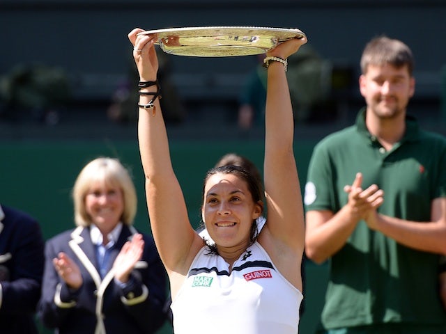 Marion Bartoli celebrates winning Wimbledon on July 6, 2013