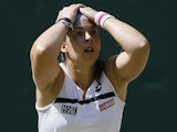 Marion Bartoli reacts to winning Wimbledon on July 6, 2013