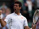 Novak Djokovic reacts after beating Tommy Haas during their Wimbledon match on July 1, 2013