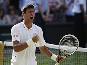 Novak Djokovic of Serbia reacts after defeating Juan Martin Del Potro of Argentina in their Men's singles semifinal match at the All England Lawn Tennis Championships on July 5, 2013