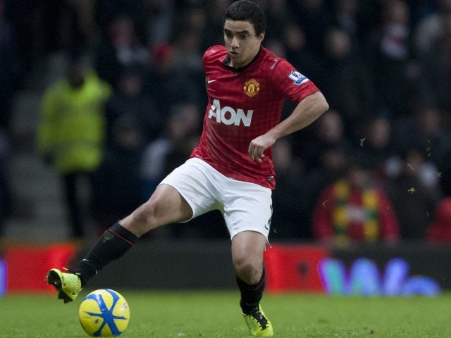 Manchester United defender Rafael da Silva controls the ball.