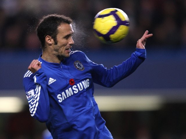 Defender Ricardo Carvalho heads clear the danger while playing for Chelsea.