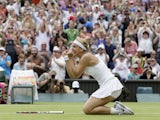 Sabine Lisicki of Germany reacts after beating Serena Williams of the United States in a Women's singles match on July 1, 2013