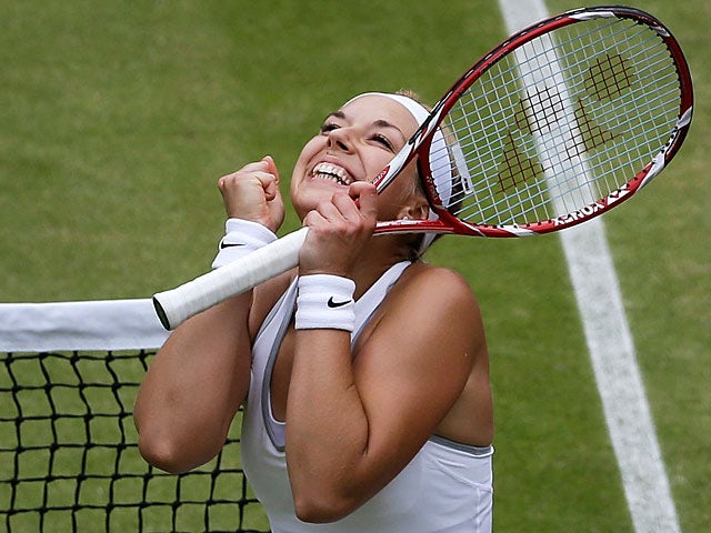 Sabine Lisicki celebrates after beating Kaia Kanepi during their Wimbledon quarter final match on July 2, 2013