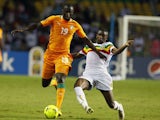 Mali's Samba Sow dives in to tackle Ivory Coast's Yaya Toure during the African Cup of Nations match on February 8, 2012