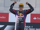 Red Bull driver Sebastian Vettel of Germany celebrates on the podium after he won the German Formula One Grand Prix on July 7, 2013