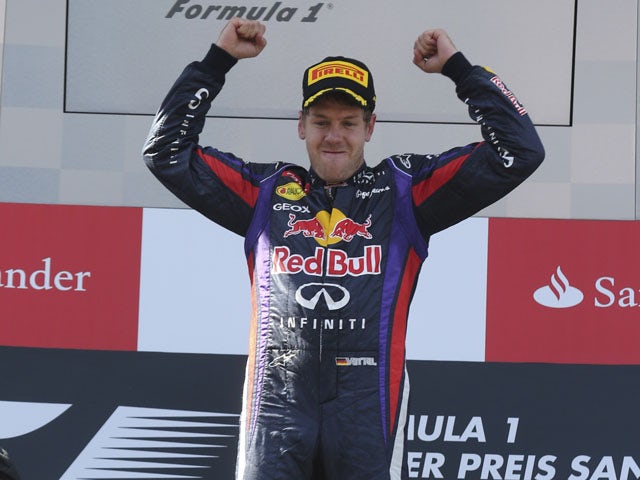 Red Bull driver Sebastian Vettel of Germany celebrates on the podium after he won the German Formula One Grand Prix on July 7, 2013