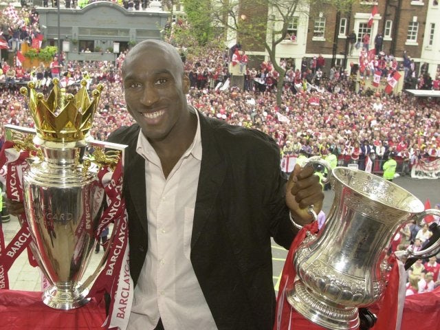 Sol Campbell celebrates winning the double with Arsenal.