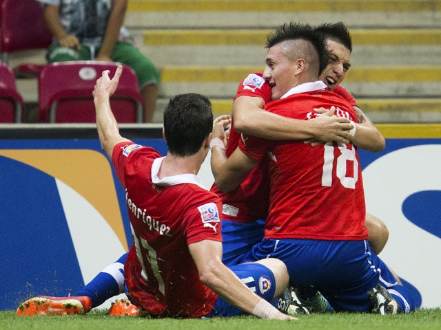 Chile's Nicolas Castillo celebrates scoring during the Under-20 World Cup quarter final soccer match between Ghana and Chile on July 7, 2013