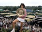Virginia Wade with the Wimbledon trophy in 1977.
