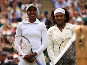 Serena and Venus Williams pose for a phot before the start of the Ladies Final on July 4, 2009