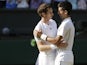 Andy Murray of Britain is congratulated by Novak Djokovic of Serbia after the Men's singles final match on July 7, 2013