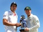 Alastair Cook and Michael Clarke pose with The Ashes urn.