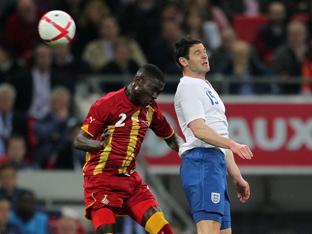 Ghana's Daniel Opare jumps for the ball alongside England's Matthew Jarvis during a friendly match on March 29, 2013