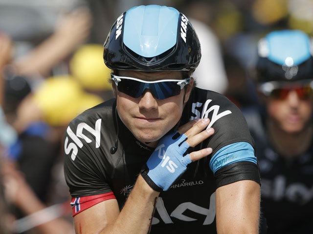 Edvald Boasson Hagen of Norway holds his injured left shoulder after crashing during the twelfth stage of the Tour de France on July 11, 2013
