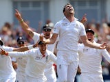 England's James Anderson and team mates celebrate after winning the First Ashes Test match at Trent Bridge on July 14, 2013