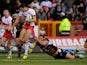 Catalan Dragons' Julian Bousquet tackles Hull KR's Craig Hall during a Super League match on February 3, 2013